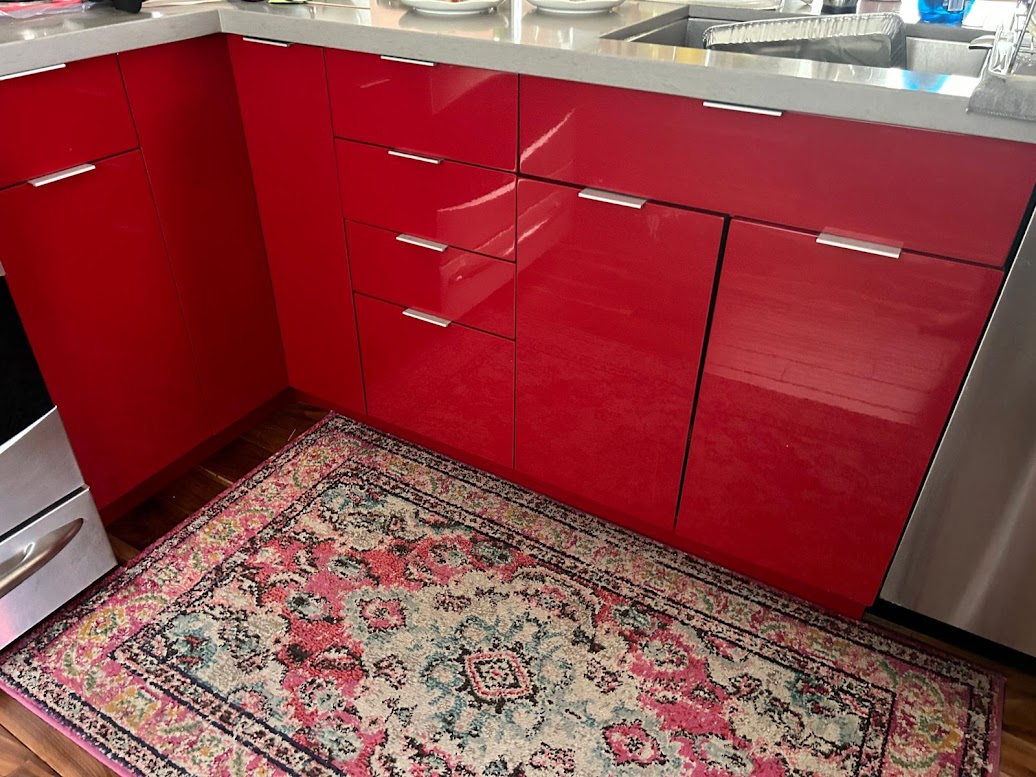 BEFORE: Glossy Red Kitchen Cabinets and Panels Awaiting Upgrade