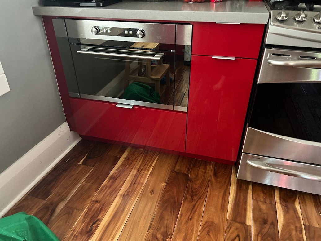 BEFORE: Glossy Red Kitchen Cabinets and Panels Awaiting Upgrade