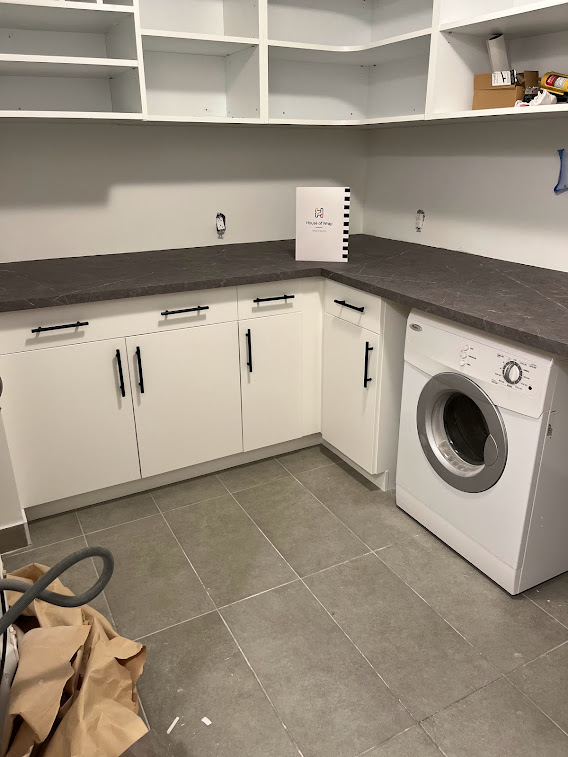 AFTER: Cabinets and Countertops Resurfaced in Matte White and Marble