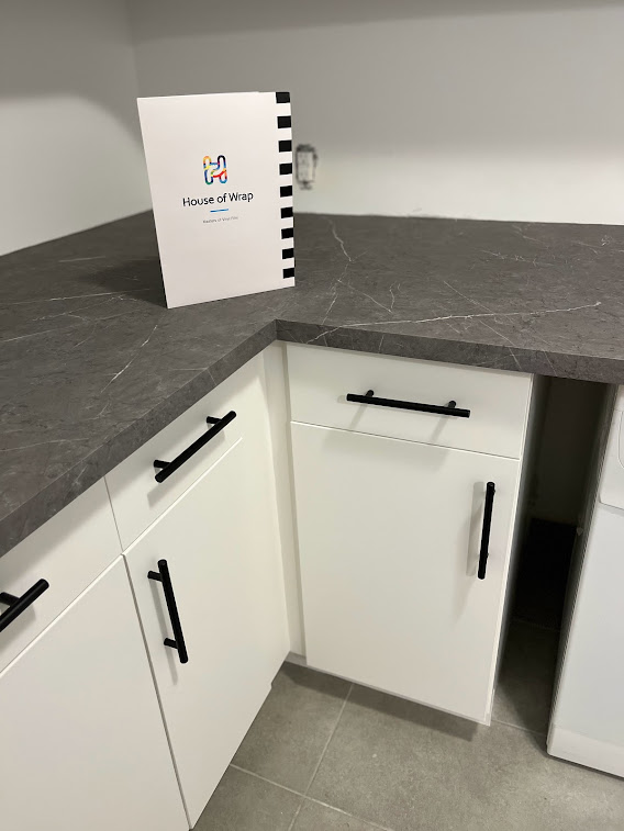 AFTER: Resurfaced Matte White Cabinets Paired with Elegant Marble Surfaces