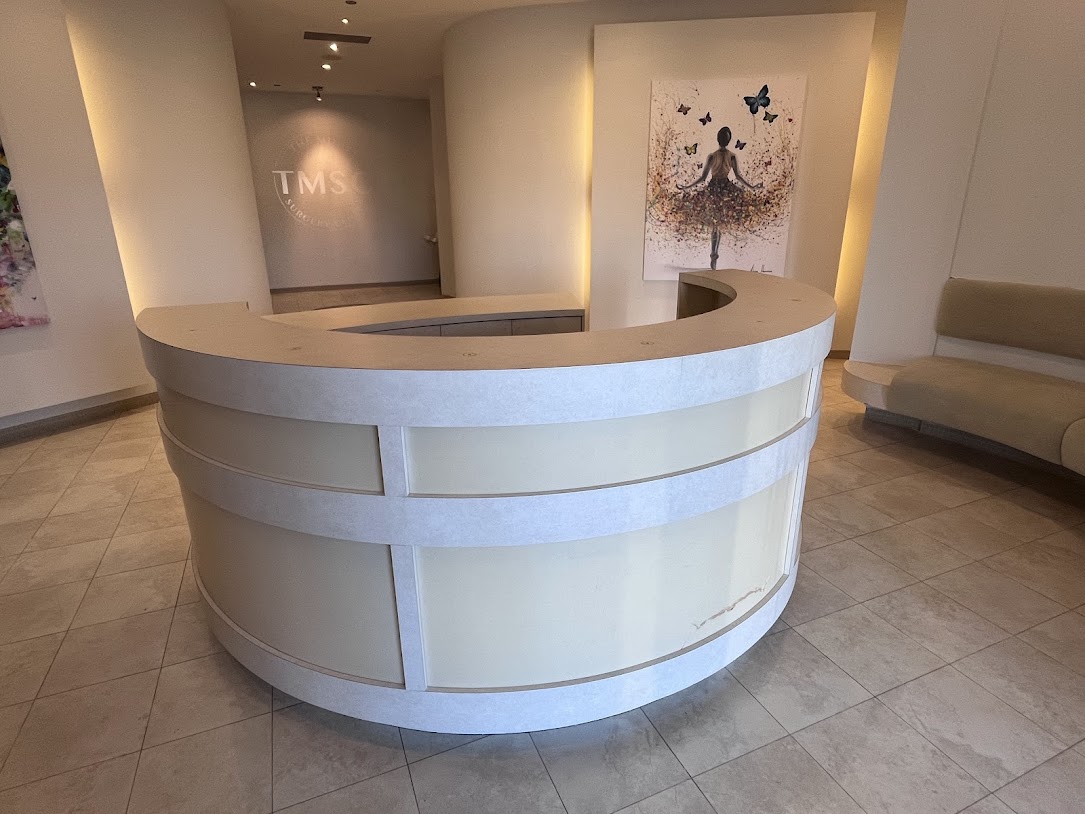 BEFORE: Reception Desk and Panels to be Resurfaced in Matte White and Glossy White Finishes
