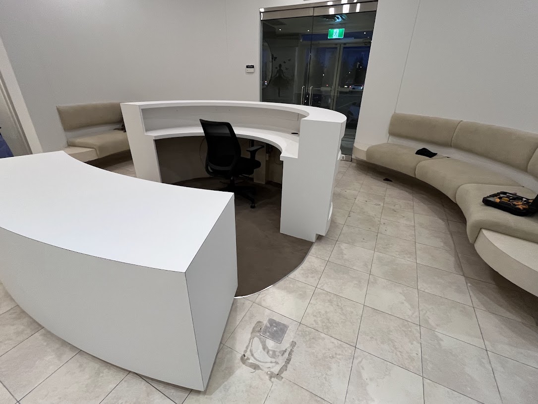 AFTER: Reception Desks Resurfaced in Matte White and Glossy White Finishes