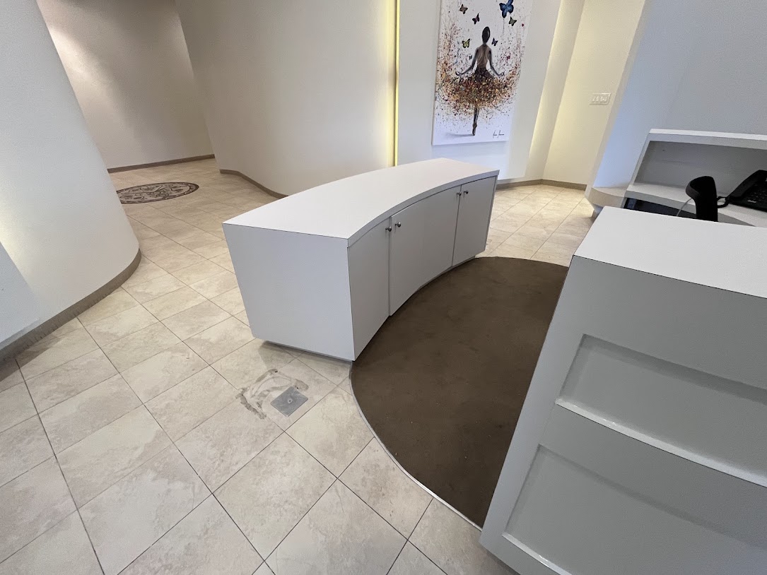 AFTER: Reception Desk Cabinets Resurfaced in Matte White