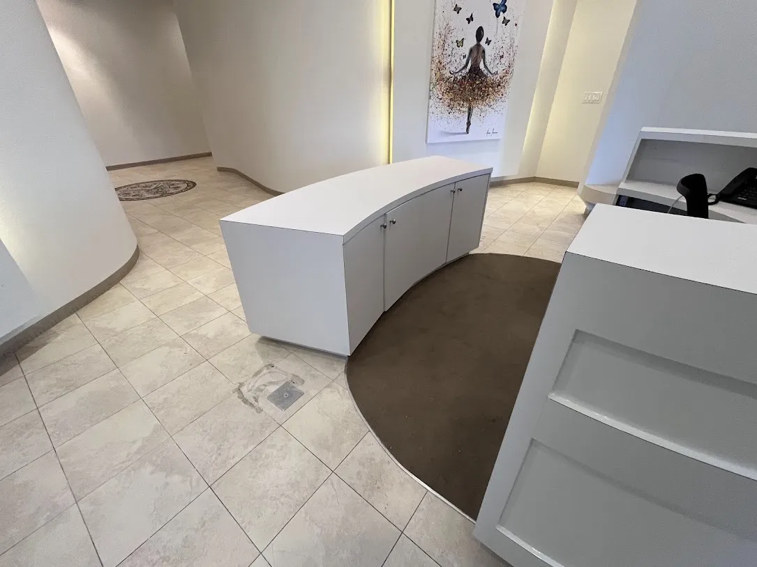 AFTER: Reception Desk Cabinets Resurfaced in Matte White