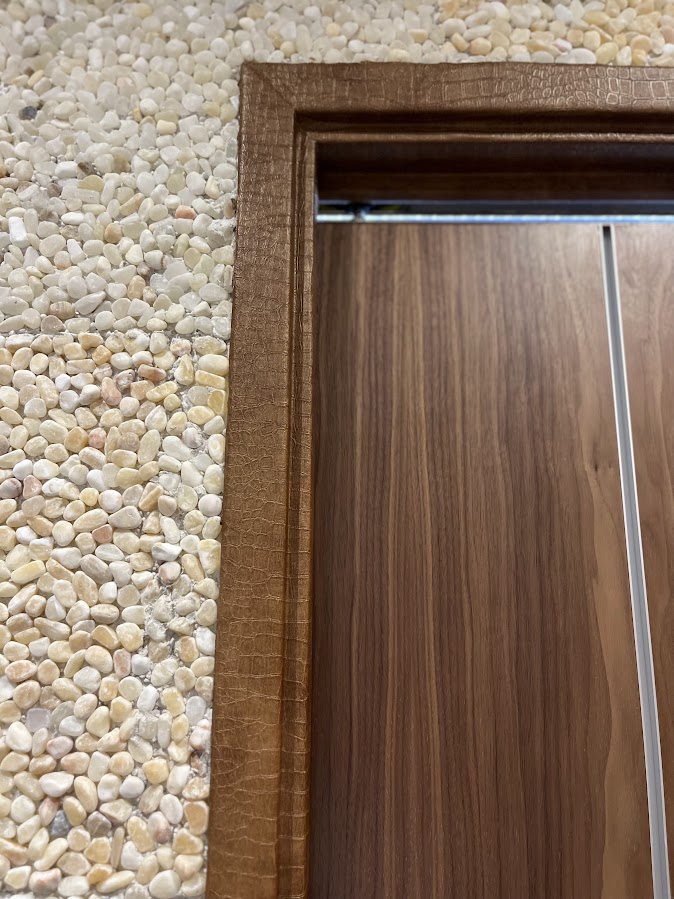 AFTER: Apartment Door Frames Resurfaced with a Chic Embossed Finish