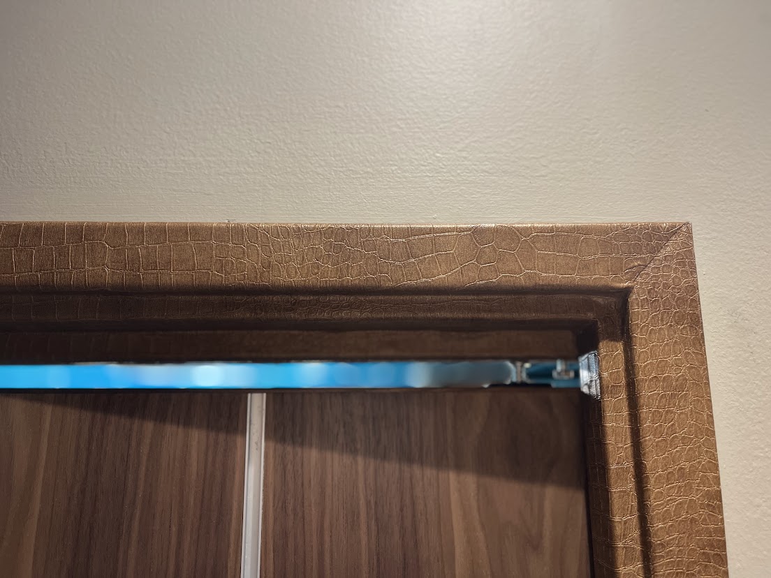 AFTER: Apartment Door Frames Resurfaced with a Chic Embossed Finish