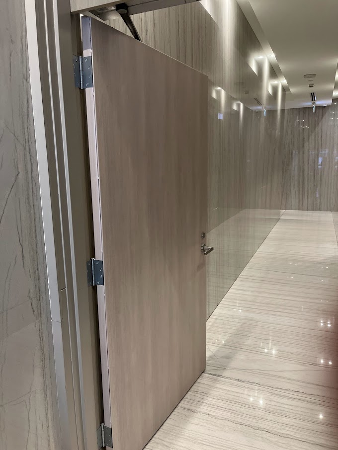 AFTER: Condominium Door in a High-Traffic Area Resurfaced with a Soft Wood Finish