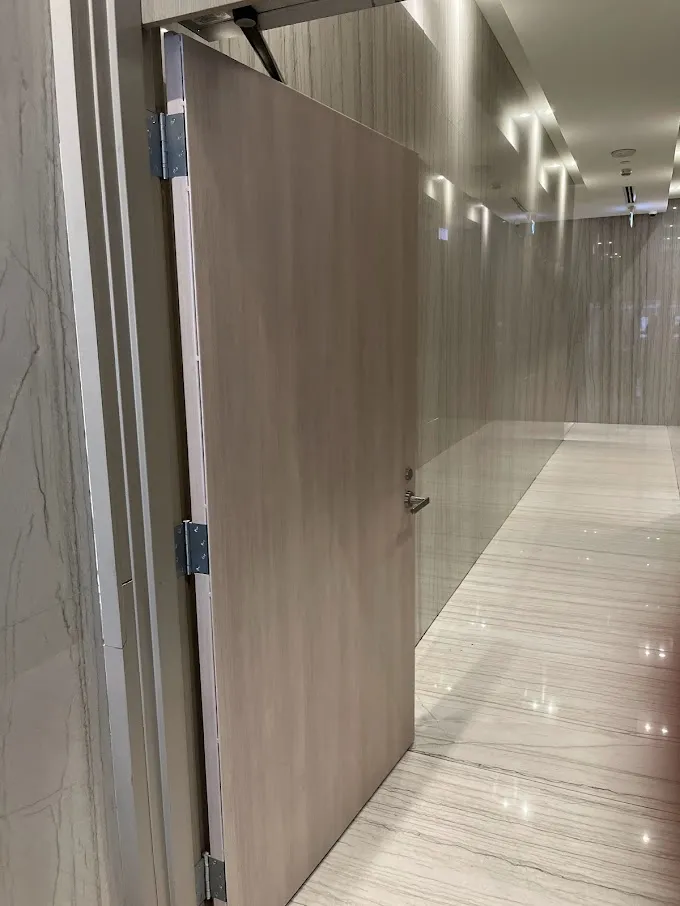 AFTER: Condominium Door in a High-Traffic Area Resurfaced with a Soft Wood Finish