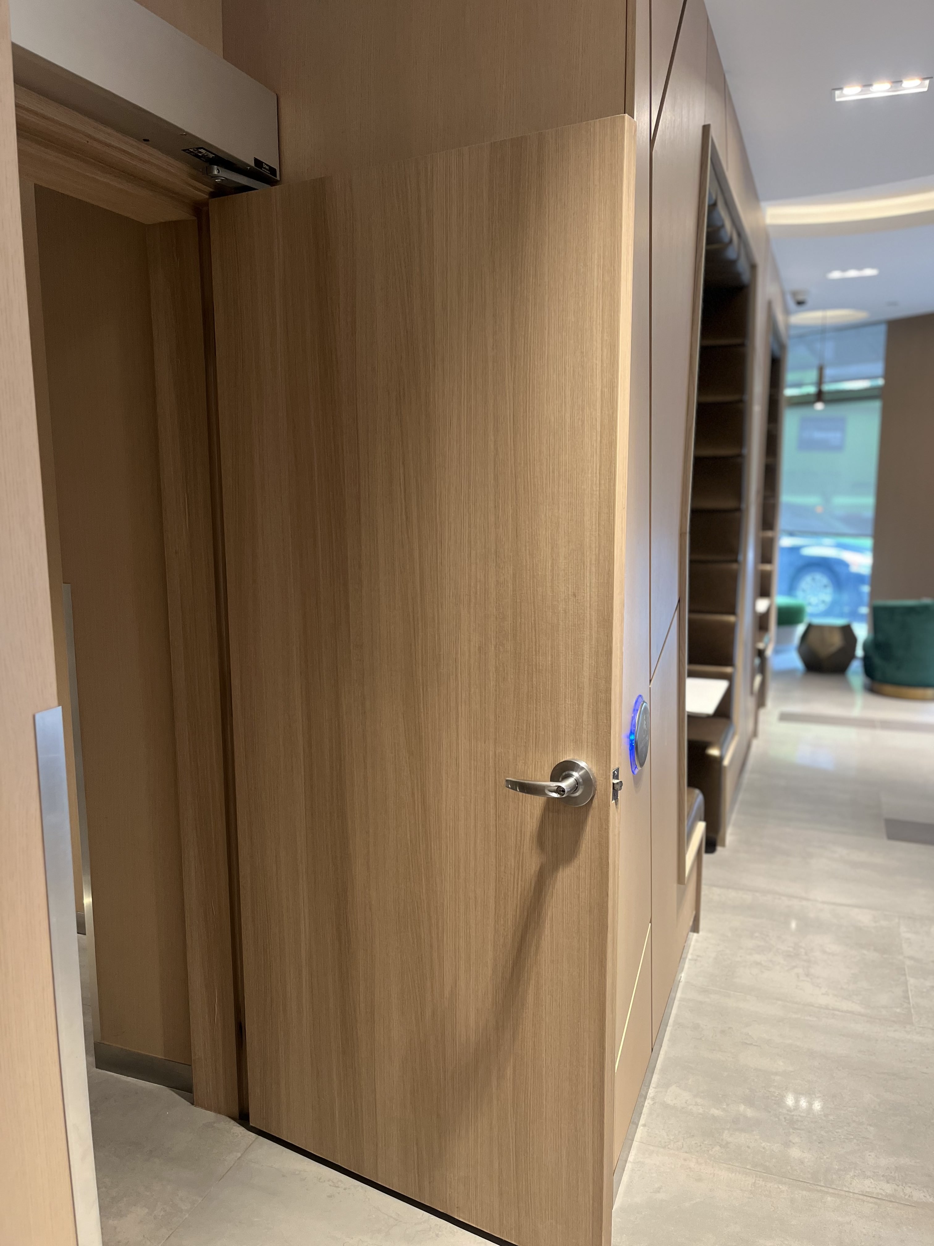 AFTER: Downtown Condominium Lobby Door Resurfaced in Natural Oak
