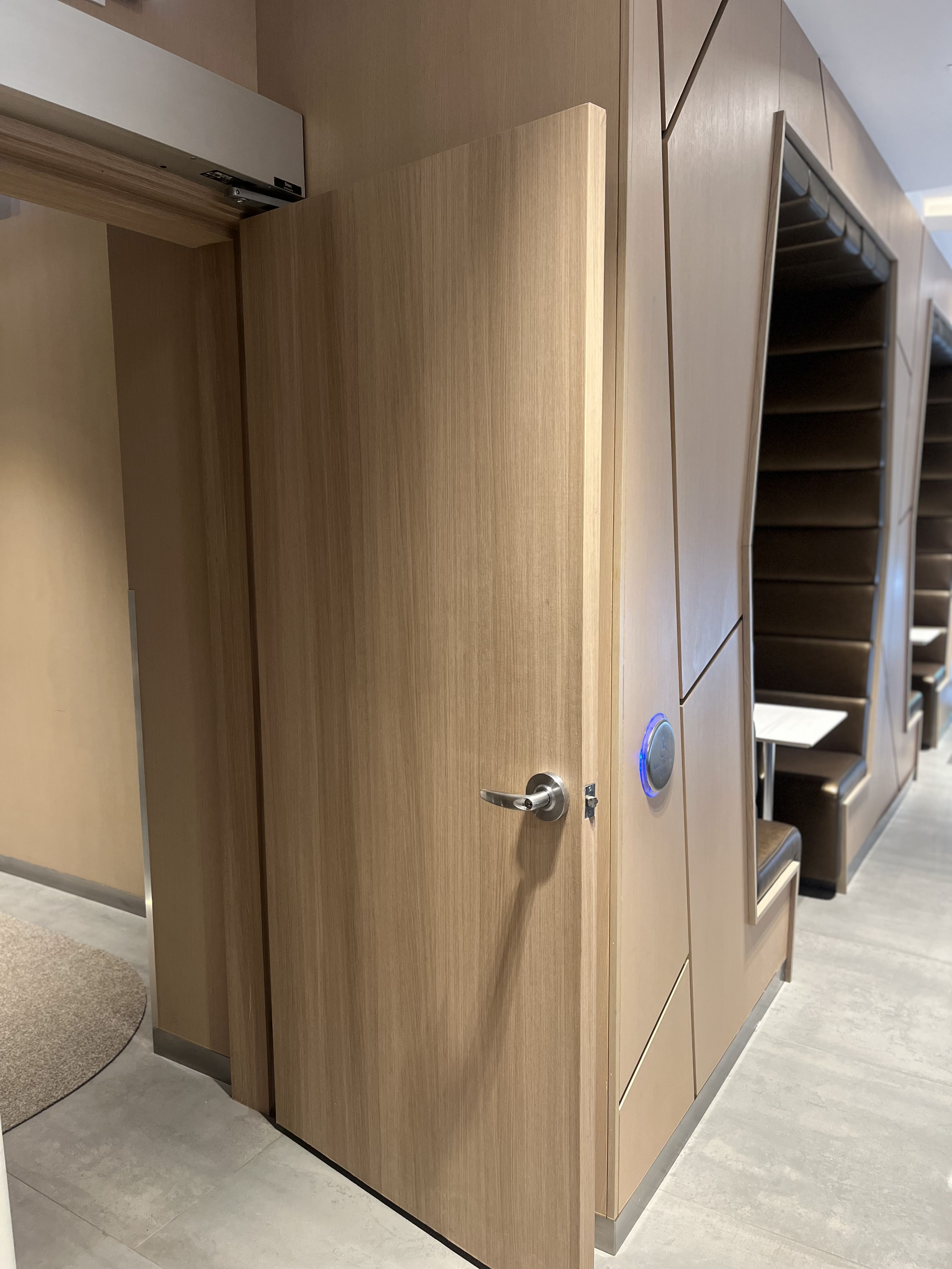 AFTER: Downtown Condominium Lobby Door Resurfaced in Natural Oak