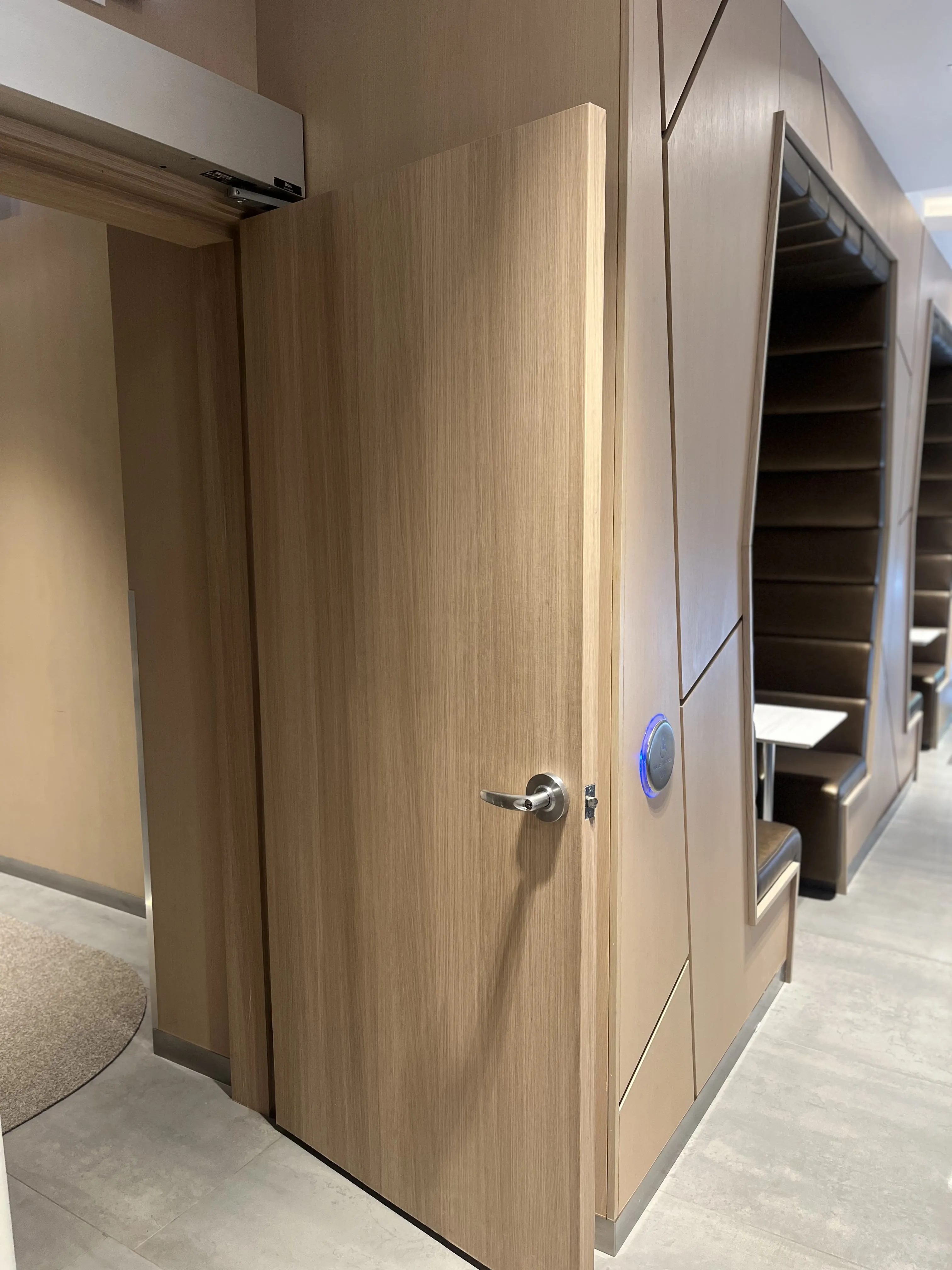 AFTER: Downtown Condominium Lobby Door Resurfaced in Natural Oak