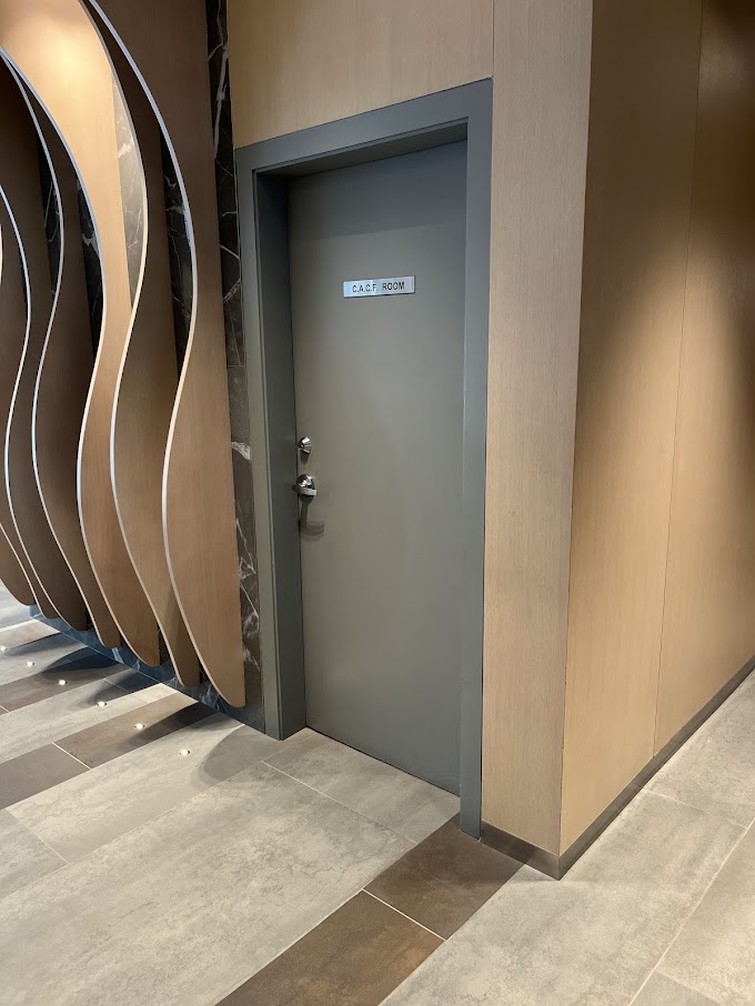 AFTER: Downtown Condominium Lobby Door Resurfaced in Natural Oak