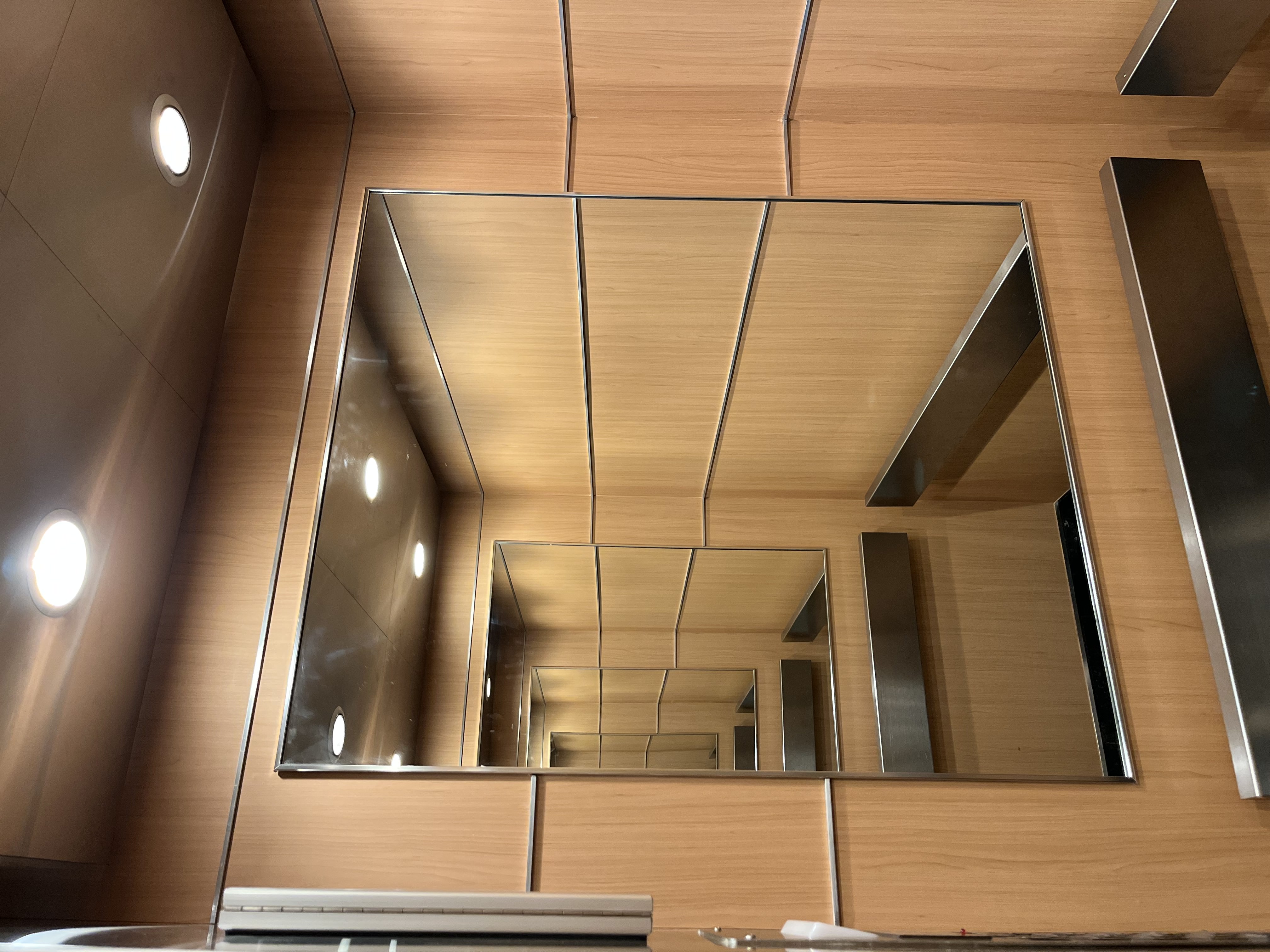 AFTER: Elevator Panels Wrapped in Light Wood Finish