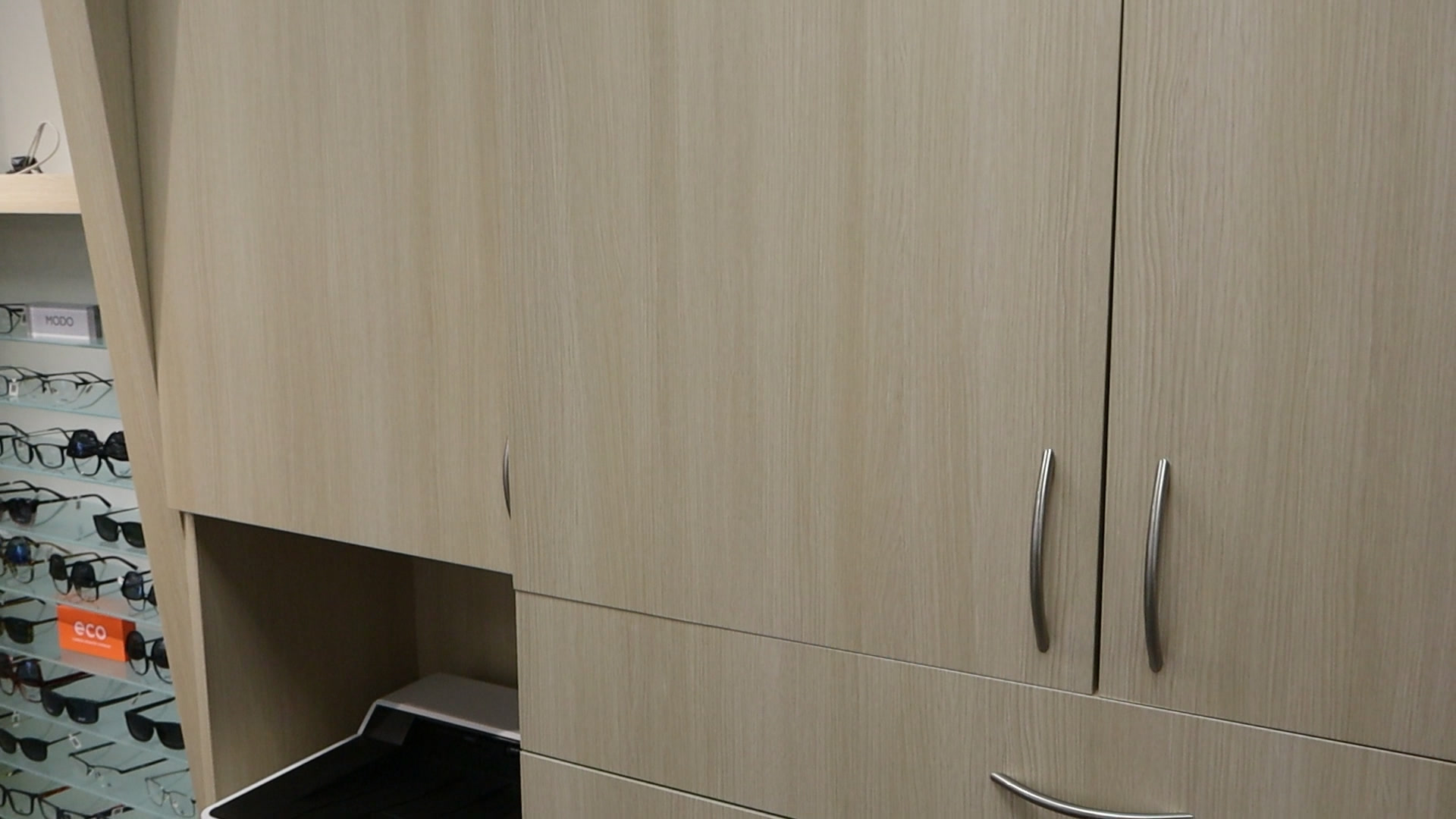 AFTER: Abbey Eye Care Reception Desk Resurfaced with Light Wood Finish