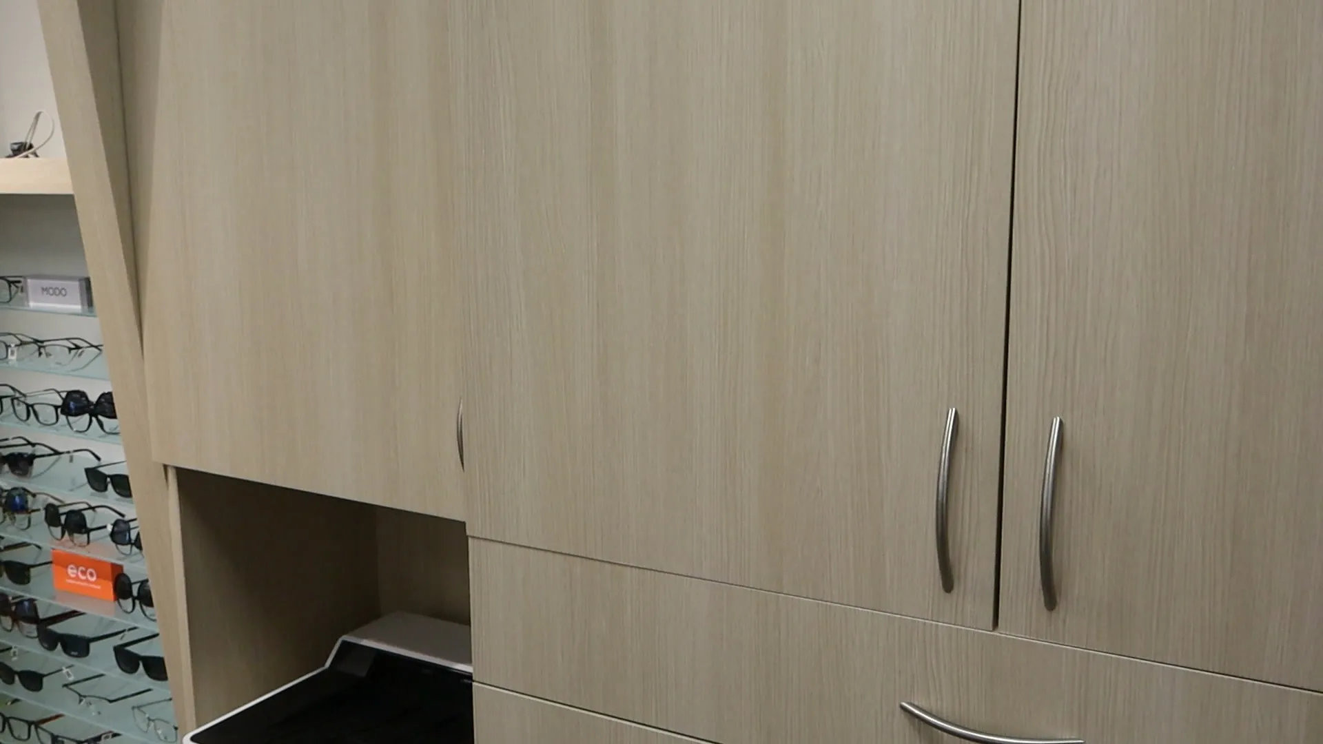 AFTER: Abbey Eye Care Reception Desk Resurfaced with Light Wood Finish