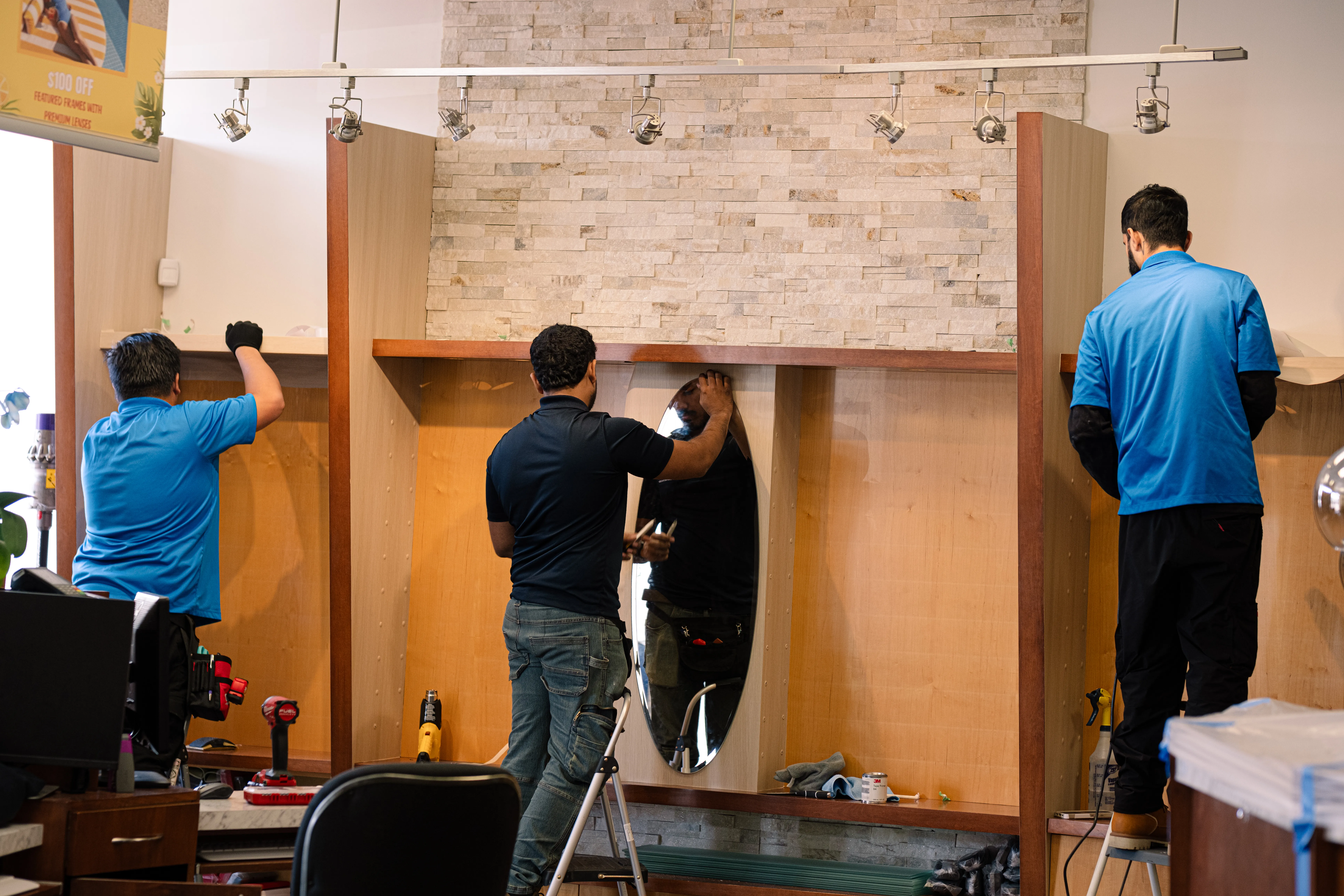 DURING: Installation in Progress on Retail Display Panels