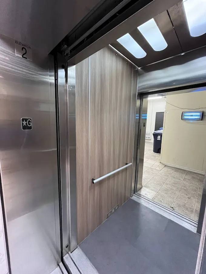 AFTER: Elevator Cabin Panels Resurfaced with a Modern Wood Finish